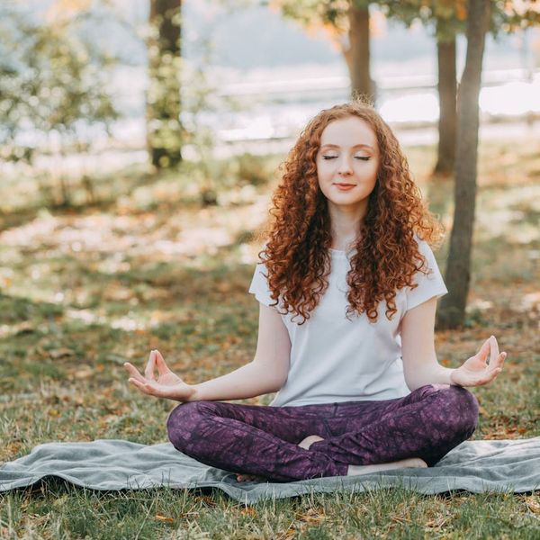 Person meditating peacefully in a calm environment, representing mental clarity.